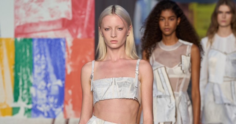Kai Schreiber opens Jason Wu's New York Fashion Runway show. She's wearing a white fabric bralette and skirt