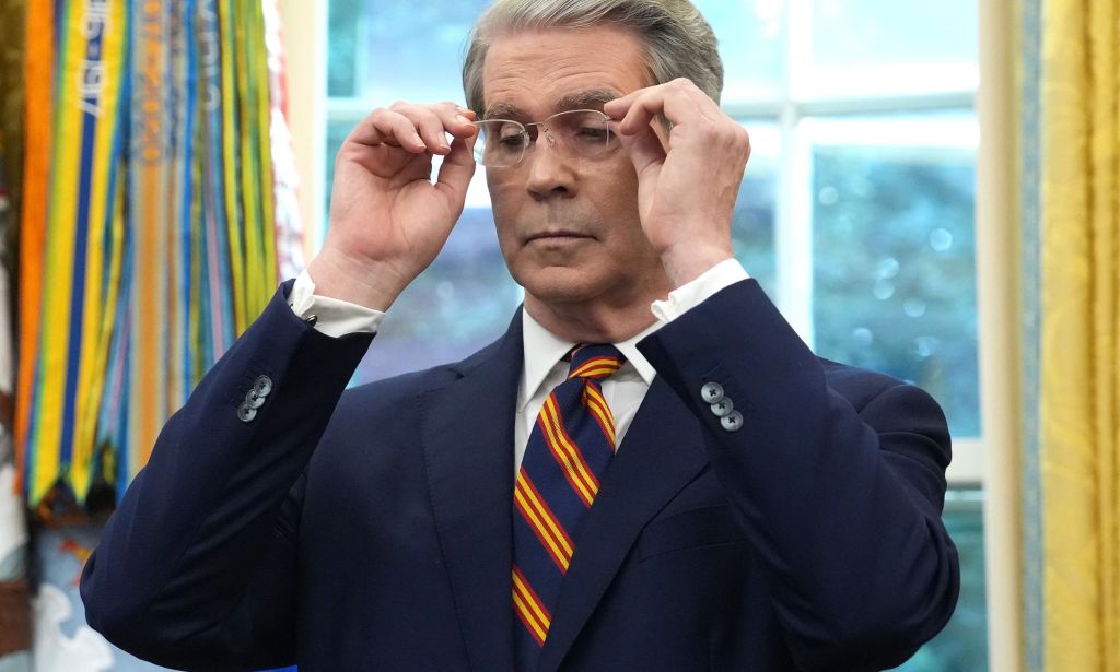 Scott Bessent removing his glasses.