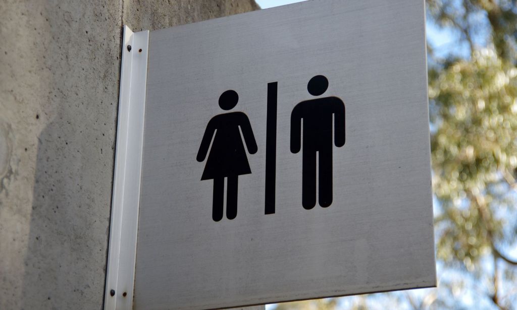 A public toilets sign.