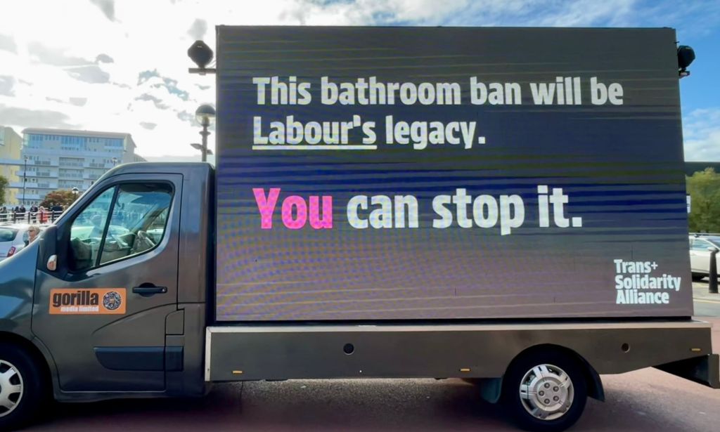 A van with the text 'This bathroom ban will be Labour's legacy. You can stop it' written on the side.
