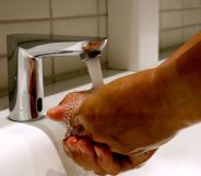 An unpictured person washing their hands.