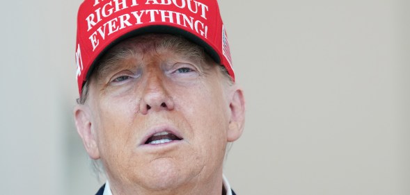 WASHINGTON, DC - AUGUST 22: U.S. President Donald Trump speaks to the media wearing a hat that reads, "Trump Was Right About Everything!," during a visit to The People's House: A White House Experience August 22, 2025 in Washington, DC. Trump spoke on a variety of issues including stating he did not know of the FBI raid currently happening on former national security adviser John Bolton's home, and saying he learned of it by seeing the news on television. (Photo by Kevin Dietsch/Getty Images)