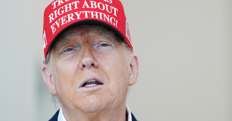 WASHINGTON, DC - AUGUST 22: U.S. President Donald Trump speaks to the media wearing a hat that reads, "Trump Was Right About Everything!," during a visit to The People's House: A White House Experience August 22, 2025 in Washington, DC. Trump spoke on a variety of issues including stating he did not know of the FBI raid currently happening on former national security adviser John Bolton's home, and saying he learned of it by seeing the news on television. (Photo by Kevin Dietsch/Getty Images)