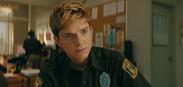 Mae Martin in a police uniform