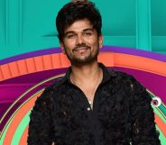 Big Brother housemate Gani in his promo image wearing a black shirt and smiling.