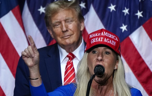 Marjorie Taylor Greene (R) speaks alongside Trump at a campaign event in Rome, Georgia, on March 9, 2024. (Photo by Elijah Nouvelage / AFP) (Photo by ELIJAH NOUVELAGE/AFP via Getty Images)