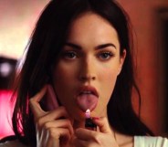 Jennifer's Body still of Megan fox on the phone with her tongue out and a lighter under it.