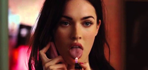 Jennifer's Body still of Megan fox on the phone with her tongue out and a lighter under it.