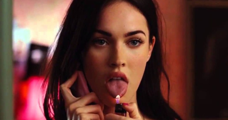Jennifer's Body still of Megan fox on the phone with her tongue out and a lighter under it.