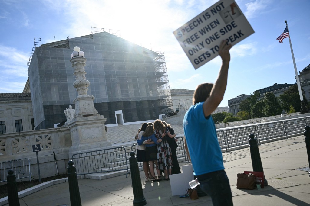 Members of the group 'Concerned Women for America' pray outside the US Supreme Court as the Court hears oral arguments in Chiles v. Salazar.