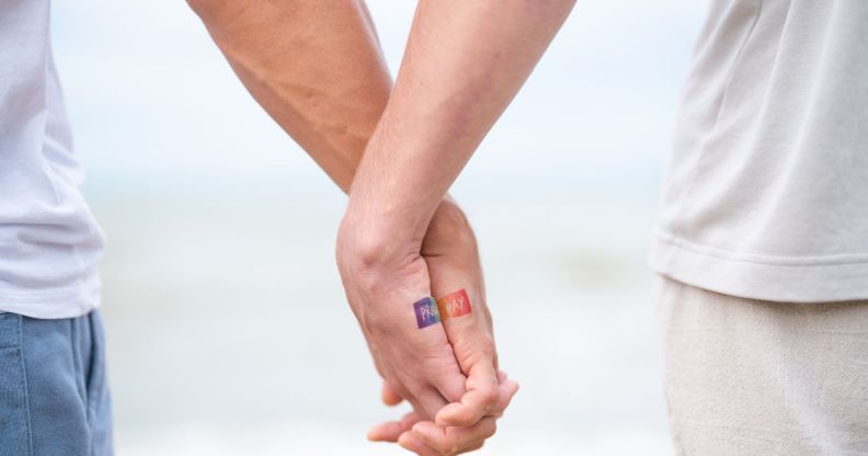 A couple holding hands.