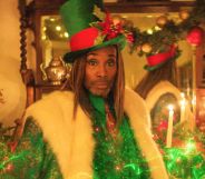 Billy Porter in green and white as the Ghost of Christmas Past in Christmas Karma