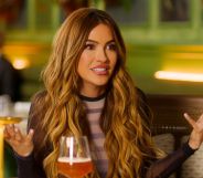 Chrishell Stause raises her hands in an 'i don't know' pose in a still from Selling Sunset.