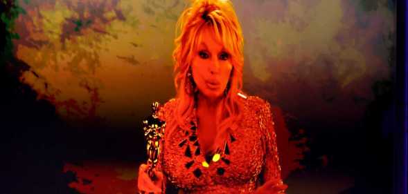 Dolly Parton appears on screen as she is honoured with the Jean Hersholt Humanitarian Award.
