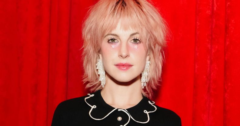 A picture of Hayley Williams in front of a red background.