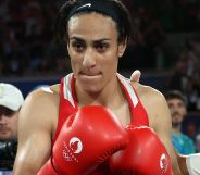 Imane Khelif wearing boxing gloves.