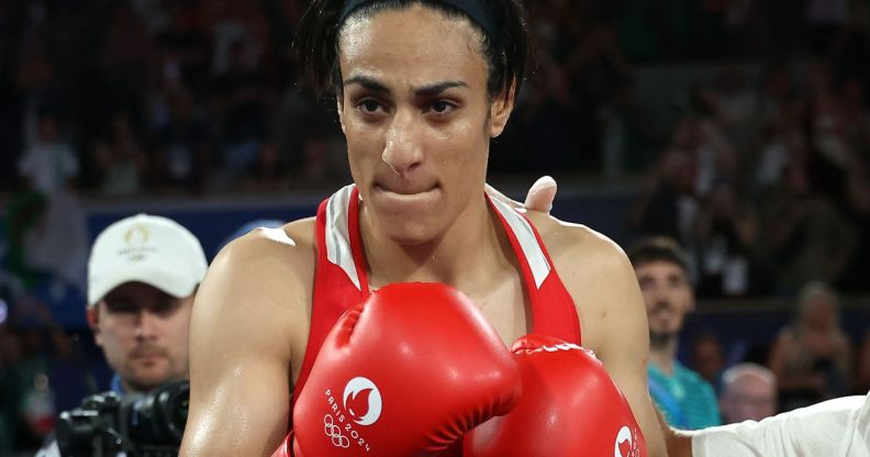 Imane Khelif wearing boxing gloves.