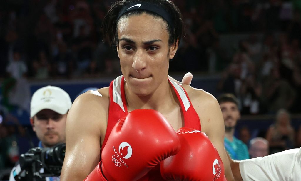 Imane Khelif wearing boxing gloves.