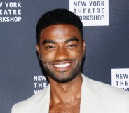 Jelani Alladin posing in a cream suit