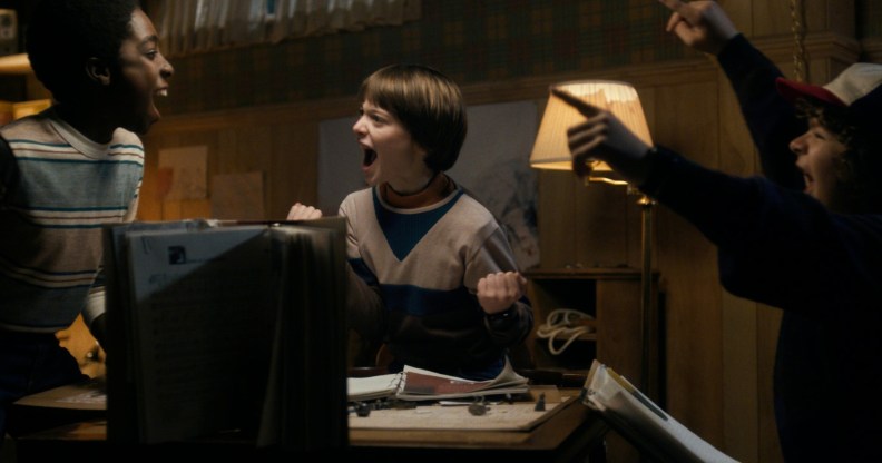 Stranger Things season 1 opening, three boys playing Dungeons & Dragons