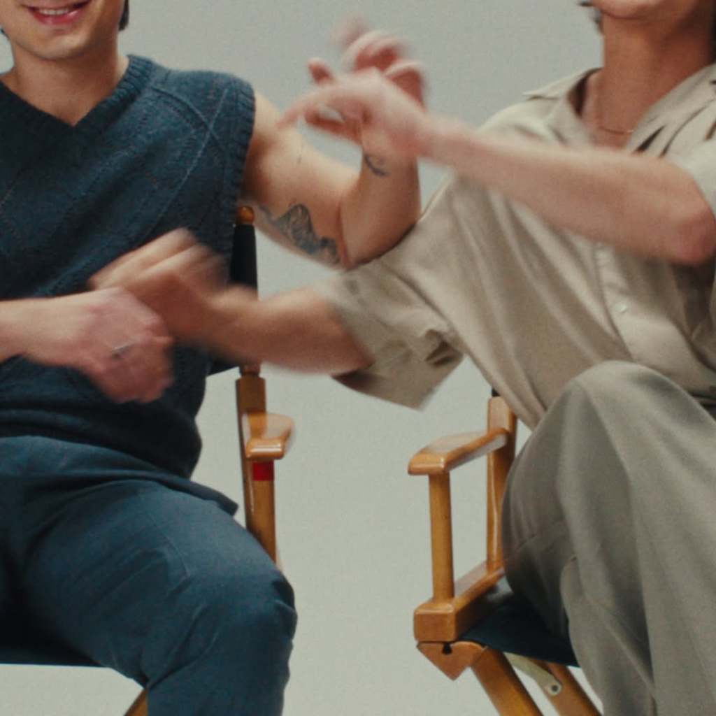 Hudson Williams and Connor Storrie's arms tangled for Quinn promo