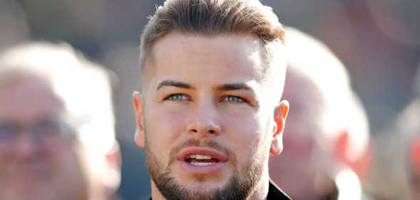 Chris Hughes watches the racing as he attends day 1 'Champion Day' of the Cheltenham Festival at Cheltenham Racecourse on March 12, 2019 in Cheltenham, England.