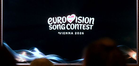 A screen shows the logo of the Eurovision Song Contest (ESC) 2026