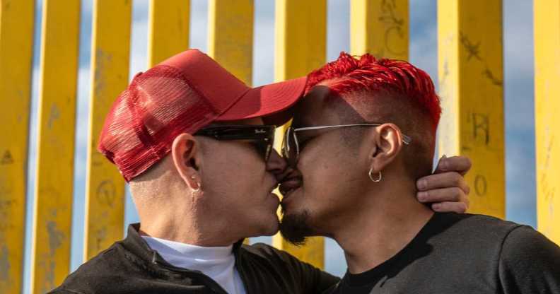 Participants kiss at MPact Global’s International HIV Kiss-In at Friendship Park.