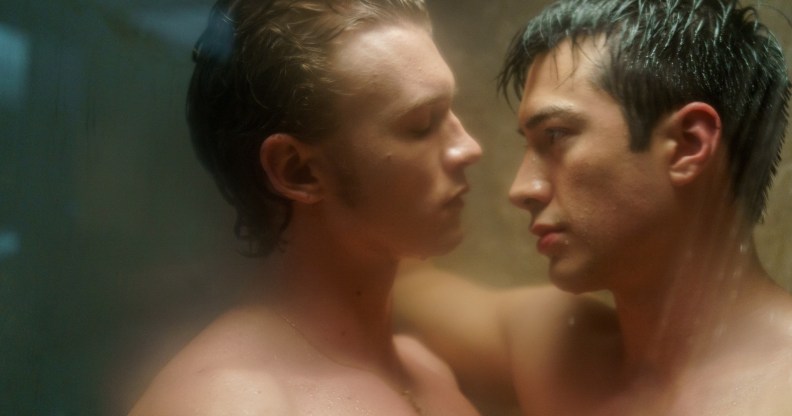 Heated Rivalry (L to R) - Connor Storrie as Ilya Rozanov and Hudson Williams as Shane Hollander. The pair are standing with their bodies pressed together in the shower.
