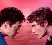 Heated Rivalry Hudson Williams as Shane Hollander and Connor Storrie as Ilya Rozanov facing off on the ice.