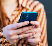 Close up of woman using smart phone