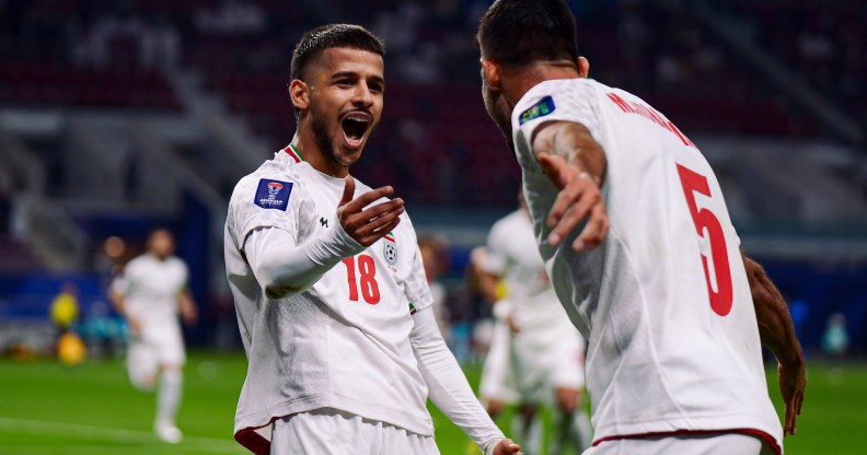 DOHA, QATAR - JANUARY 19: M. Ghayedi #18 of Iran celebrates scoring his team's first goal during the AFC Asian Cup Qatar 2023 second round Group C match between Hong Kong and Iran at Khalifa International Stadium on January 19, 2024 in Doha, Qatar. (Photo by Gao Meng/VCG via Getty Images)