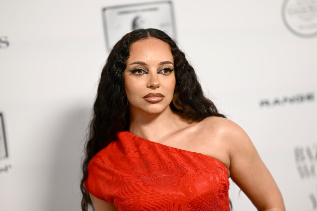 JADE in a red dress on a red carpet