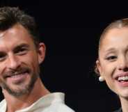 Jonathan Bailey and Ariana Grande smile