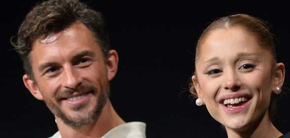 Jonathan Bailey and Ariana Grande smile