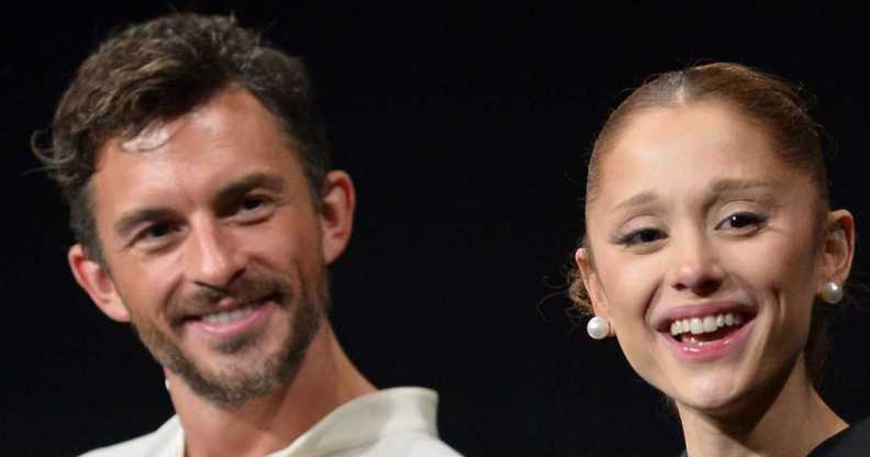 Jonathan Bailey and Ariana Grande smile