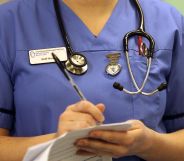 A nurse writing on a document.