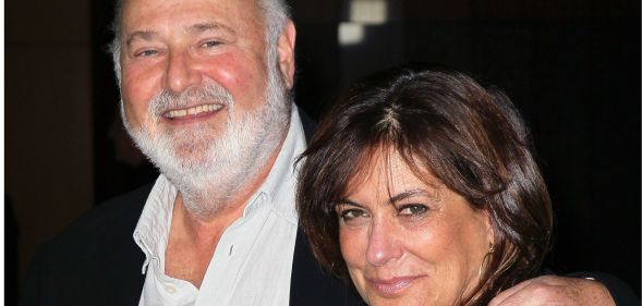 An older white man with his arm around the shoulder of his wife, a black-haired white woman.