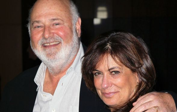 An older white man with his arm around the shoulder of his wife, a black-haired white woman.