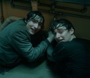 Finn Wolfhard and Noah Schnapp on a bathroom floor in Stranger Things season five.