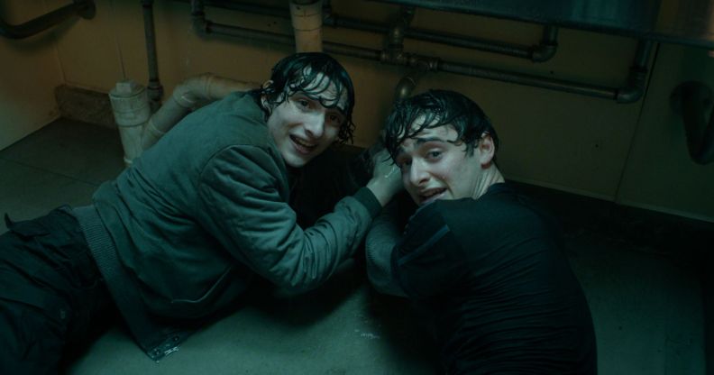 Finn Wolfhard and Noah Schnapp on a bathroom floor in Stranger Things season five.