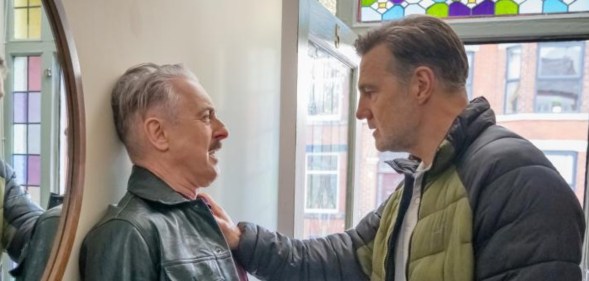 Tip Toe still: Alan Cumming as Leo being pinned against the wall by David Morrissey as Clive