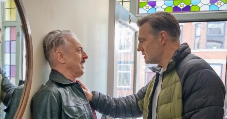 Tip Toe still: Alan Cumming as Leo being pinned against the wall by David Morrissey as Clive