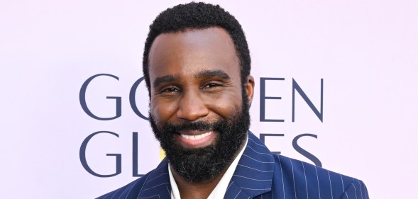 Tramell Tillman at the Golden Globes' First Time Nominees Luncheon. He's wearing a white shirt and pinstripe dark blue blazer