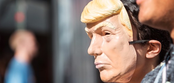 Atlanta, GA, USA - October 21, 2017: A person wears a Donald Trump mask at the Little Five Points Halloween Parade on October 21, 2017 in Atlanta, GA.