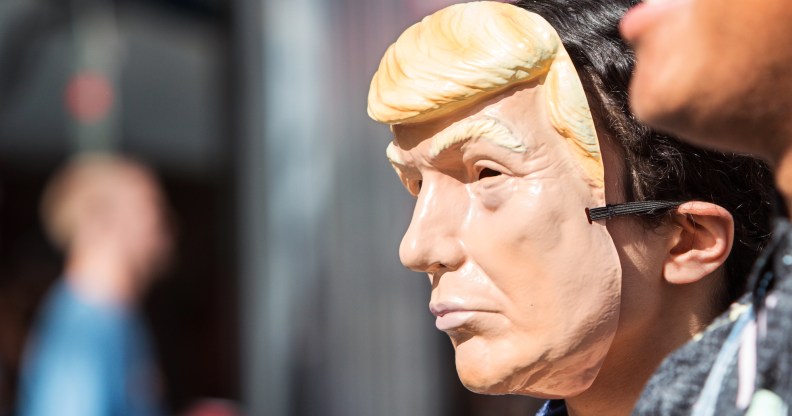 Atlanta, GA, USA - October 21, 2017: A person wears a Donald Trump mask at the Little Five Points Halloween Parade on October 21, 2017 in Atlanta, GA.