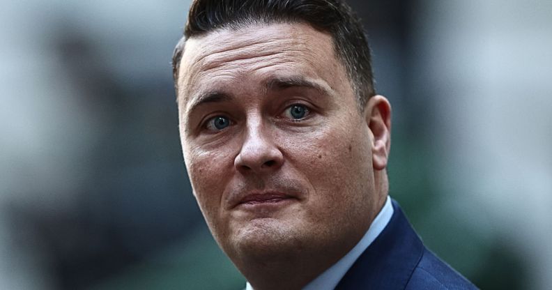 A close-up of Wes Streeting as he walks by.