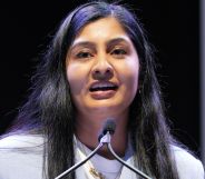 A portrait image of Zarah Sultana standing at a podium