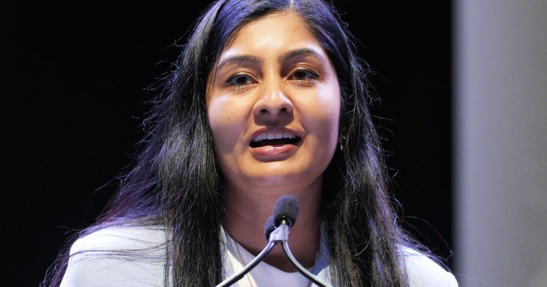 A portrait image of Zarah Sultana standing at a podium