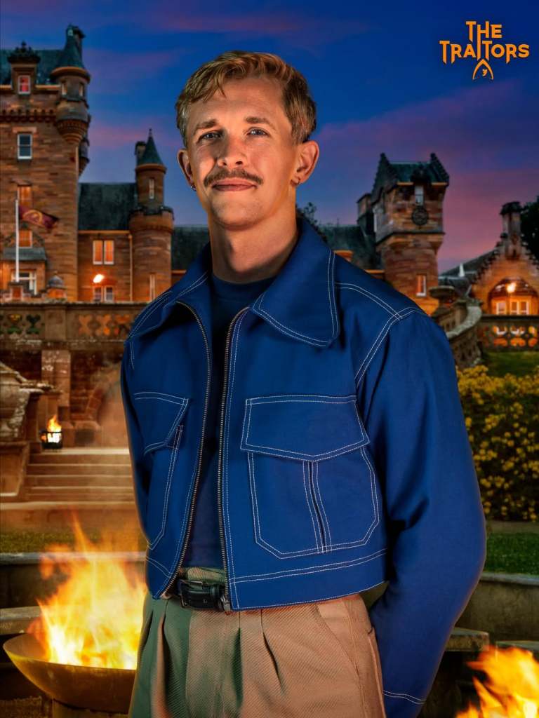 Stephen in front of The Traitors castle in a blue jacket